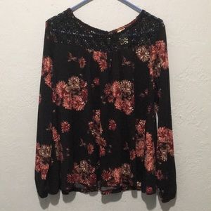 Floral Long Sleeve with a Crocheted Neck Portion.